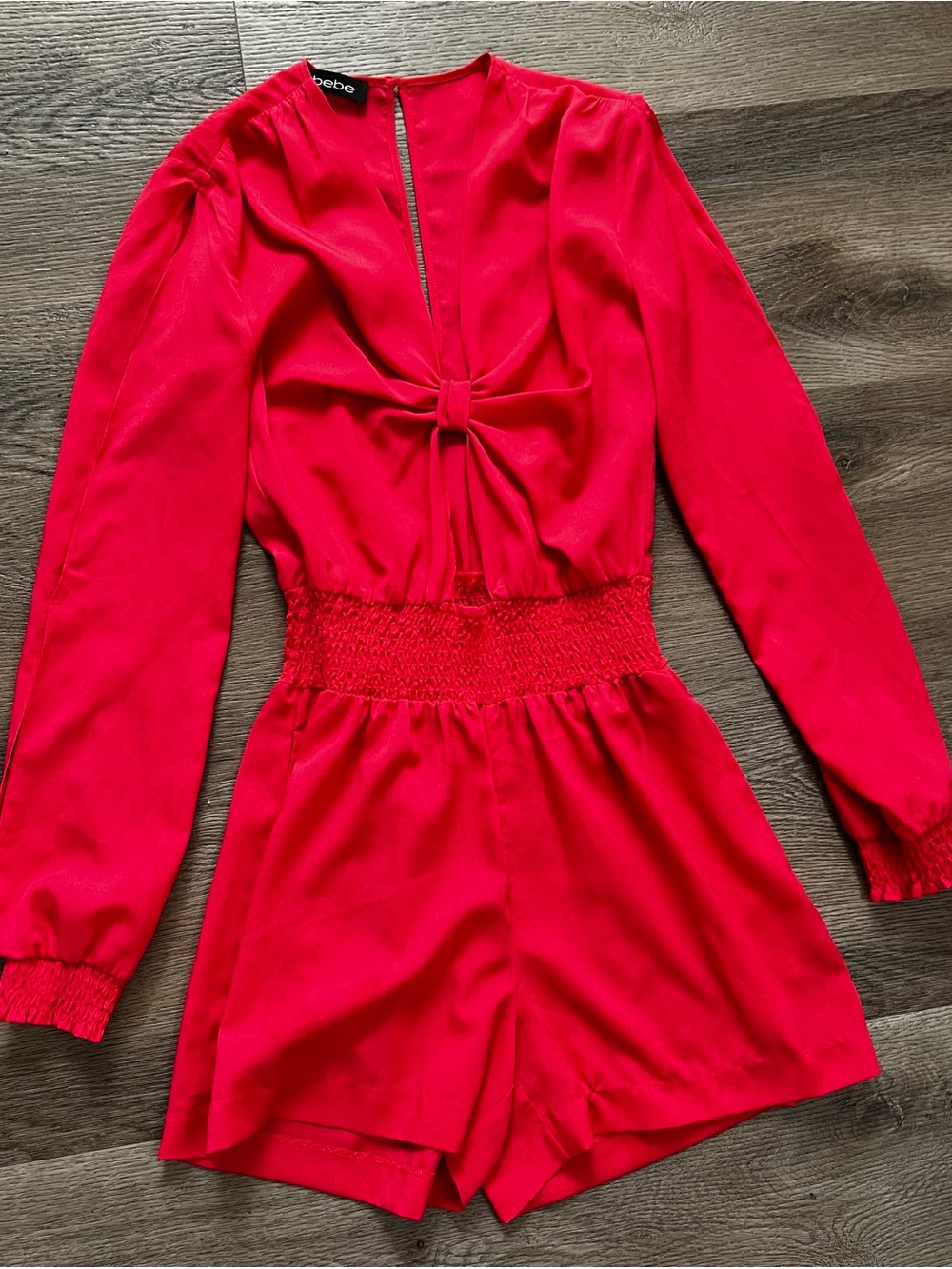 bebe orange jumpsuit.